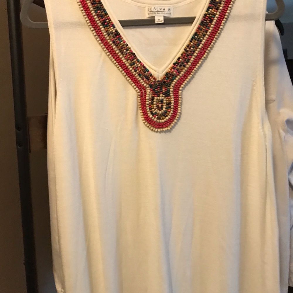 Very lightweight tunic/tee. Beautiful bead work.